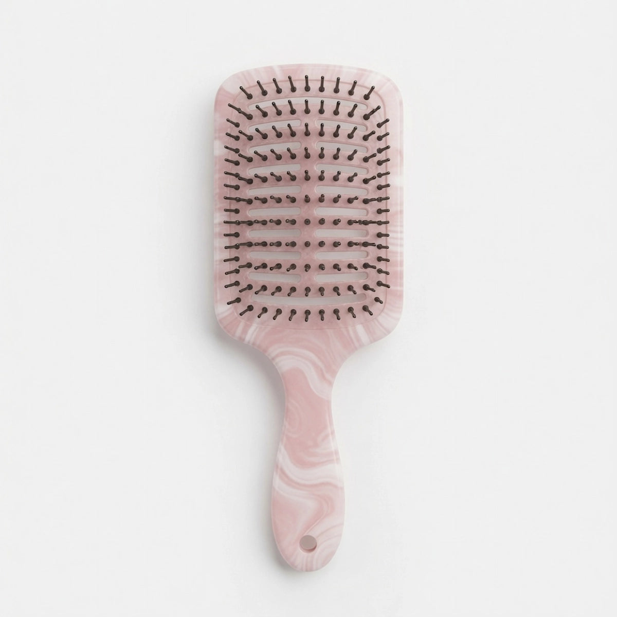 Custom marble hair brush designed for retail and salon collections.

