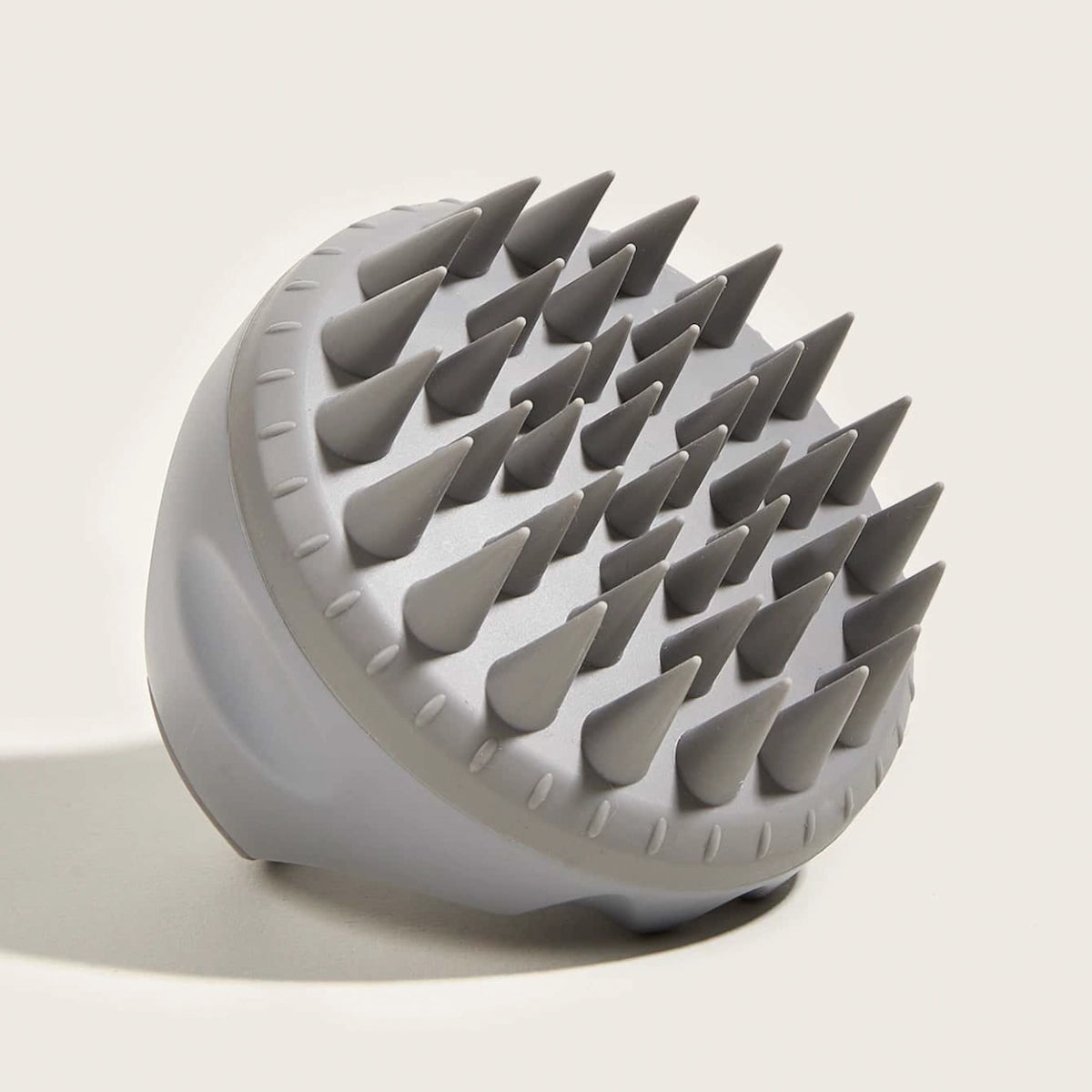 Silicone scalp brush for cleansing, exfoliating, and promoting healthy hair growth.