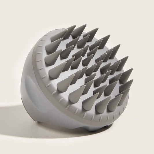 Silicone scalp brush for cleansing, exfoliating, and promoting healthy hair growth.